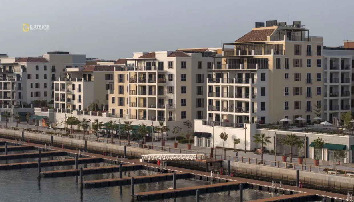 Mediterranean-style apartment buildings beside marina berths at Port de La Mer, La Mer, Dubai