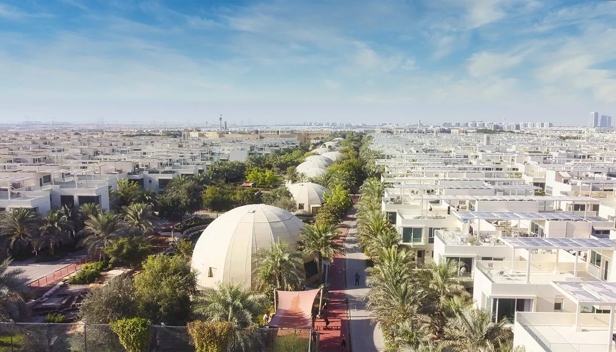 Aerial view of The Sustainable City Dubai residential clusters and green corridors