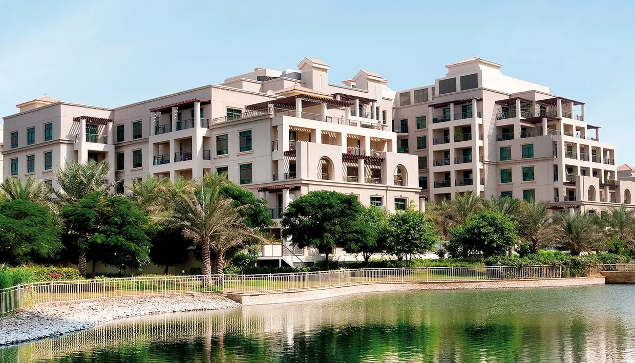 Upper view of landscaped lakes and residential towers in Emaar The Greens and Views